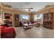 Relaxing living room with comfortable sofas, a ceiling fan, and plantation shutters at 2151 Bannerwood St, Henderson, NV 89044