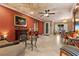 Spacious living room with ceiling fan, decorative fireplace, and custom painted ceiling at 2151 Bannerwood St, Henderson, NV 89044
