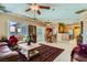 Cozy living room with tile flooring, comfortable seating, and an open layout at 2151 Bannerwood St, Henderson, NV 89044