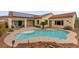 Aerial view of backyard pool, tanning ledge and patio area surrounded by mature landscaping at 2151 Bannerwood St, Henderson, NV 89044