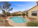 Backyard pool with patio area surrounded by mature landscaping and seating area at 2151 Bannerwood St, Henderson, NV 89044