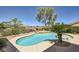 Beautiful backyard pool with mature landscaping and seating area in a private setting at 2151 Bannerwood St, Henderson, NV 89044
