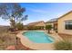 Backyard pool with patio area surrounded by mature landscaping and seating area at 2151 Bannerwood St, Henderson, NV 89044