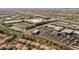 Stunning aerial view of the vibrant community, showcasing shopping centers and residential areas with lush landscaping at 2185 High Mesa Dr, Henderson, NV 89012