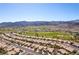 An aerial view showing a beautiful community featuring homes and a golf course at 2185 High Mesa Dr, Henderson, NV 89012