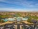 Exceptional aerial view of the community clubhouse, golf course, and surrounding desert landscape at 2185 High Mesa Dr, Henderson, NV 89012