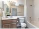 Bathroom features a single sink vanity, bathtub, and tiled shower at 2185 High Mesa Dr, Henderson, NV 89012