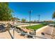 Recreational area featuring bocce ball courts, covered seating, and beautiful landscaping at 2185 High Mesa Dr, Henderson, NV 89012