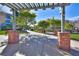 Community park featuring well-maintained green spaces and walkways shaded by trellises, perfect for outdoor enjoyment at 2185 High Mesa Dr, Henderson, NV 89012