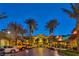 Vibrant community retail area with palm trees, shopping, dining, and ample parking at 2185 High Mesa Dr, Henderson, NV 89012