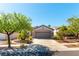 Well maintained home with a two car garage, mature trees and desert landscaping at 2185 High Mesa Dr, Henderson, NV 89012