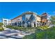 Attractive restaurant exterior with outdoor seating, lush landscaping, and ample parking at 2185 High Mesa Dr, Henderson, NV 89012