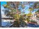 Second story balcony offers views of complex landscaping and mature tree canopy at 2201 Ramsgate Dr # 128, Henderson, NV 89074
