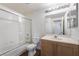 Bathroom featuring a vanity sink, a shower-tub, and neutral decor at 2201 Ramsgate Dr # 128, Henderson, NV 89074