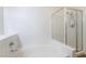 A clean bathroom with a tub and a shower with a glass door at 2201 Ramsgate Dr # 128, Henderson, NV 89074