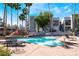 Community pool with comfortable lounge seating and easy access to buildings at 2201 Ramsgate Dr # 128, Henderson, NV 89074