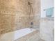 This bathroom features a shower with hand-held sprayer and decorative tile border at 2462 Pickwick Dr, Henderson, NV 89014