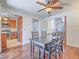 Cozy dining room features hardwood floors and space for seating, adjacent to kitchen at 2462 Pickwick Dr, Henderson, NV 89014