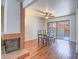 Dining room featuring hardwood floors, fireplace, and access to the outdoor patio at 2462 Pickwick Dr, Henderson, NV 89014