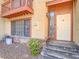 Exterior of the home featuring a small second story outdoor porch and front door at 2462 Pickwick Dr, Henderson, NV 89014
