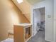 Upstairs hallway featuring storage and a view into the carpeted bonus room at 2462 Pickwick Dr, Henderson, NV 89014