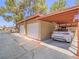 View of one-car covered parking with car parked, and additional garage space available at 2462 Pickwick Dr, Henderson, NV 89014