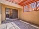 A shaded patio with brick flooring and outdoor living space at 2462 Pickwick Dr, Henderson, NV 89014