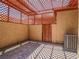 A shaded patio with brick flooring, outdoor living space, and external AC Unit at 2462 Pickwick Dr, Henderson, NV 89014