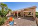Spacious backyard patio with mature landscaping, perfect for outdoor entertaining at 2521 Roseworthy Dr, Las Vegas, NV 89134