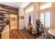 Entryway with wood floors, an interior window, and a view through to other rooms at 2521 Roseworthy Dr, Las Vegas, NV 89134
