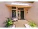 Inviting front entry with a cozy bench, decorative plants, and a secure front door at 2521 Roseworthy Dr, Las Vegas, NV 89134