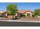 Attractive home exterior featuring a manicured front yard and a two-car garage at 2521 Roseworthy Dr, Las Vegas, NV 89134