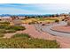 A scenic view of the golf course showcasing the landscape and city in the distance at 2521 Roseworthy Dr, Las Vegas, NV 89134