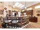Stylish kitchen with breakfast bar, stainless steel appliances and bright lighting at 2521 Roseworthy Dr, Las Vegas, NV 89134