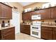 Eat-in kitchen with tile floors, a double oven, granite countertops, and lots of natural lighting at 2521 Roseworthy Dr, Las Vegas, NV 89134