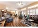 Open concept living room with tile floors, lots of light, and comfortable seating at 2521 Roseworthy Dr, Las Vegas, NV 89134