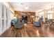Open living room with modern wood accent wall and plantation shutters at 2521 Roseworthy Dr, Las Vegas, NV 89134