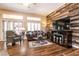 Cozy living room featuring a decorative wood wall and plantation shutters at 2521 Roseworthy Dr, Las Vegas, NV 89134