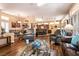 Open concept living room showcases wood floors, skylights, and inviting seating at 2521 Roseworthy Dr, Las Vegas, NV 89134
