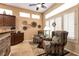 Bright sitting area featuring large windows, tile floors, and comfortable seating at 2521 Roseworthy Dr, Las Vegas, NV 89134