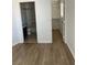 Bedroom featuring hardwood flooring next to bathroom and closet at 2528 Sierra Bello Ave # 103, Las Vegas, NV 89106