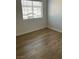 Cozy bedroom with natural light and hardwood floors at 2528 Sierra Bello Ave # 103, Las Vegas, NV 89106