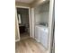 Convenient laundry area with modern appliances, next to a bathroom at 2528 Sierra Bello Ave # 103, Las Vegas, NV 89106