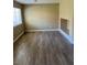 Open living space with hardwood floors and a bright window at 2528 Sierra Bello Ave # 103, Las Vegas, NV 89106