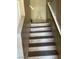 A view of the staircase showcasing its design and wooden steps with adjacent walls at 2528 Sierra Bello Ave # 103, Las Vegas, NV 89106