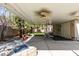 Relaxing backyard patio with fans, a swing, and a stylish built-in fire pit at 2543 Farmington Ave, Las Vegas, NV 89120