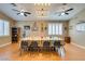 Bright dining room with a large table, modern lighting, and elegant wood floors at 2543 Farmington Ave, Las Vegas, NV 89120