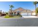 Charming single-story home with a three-car garage, mature palm trees, and a well-manicured lawn at 2543 Farmington Ave, Las Vegas, NV 89120