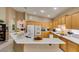 Open kitchen with modern appliances, a breakfast bar, and plenty of natural light at 2543 Farmington Ave, Las Vegas, NV 89120