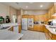 Well-lit kitchen featuring ample counter space, a breakfast bar, and modern appliances at 2543 Farmington Ave, Las Vegas, NV 89120